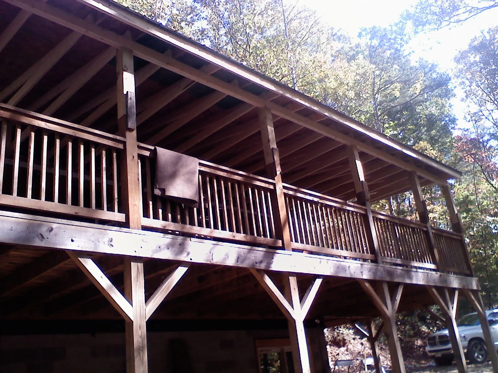 Timber framing under a new elevated porch and deck — Roof Leak Repair in Royalston by Roofing Brothers